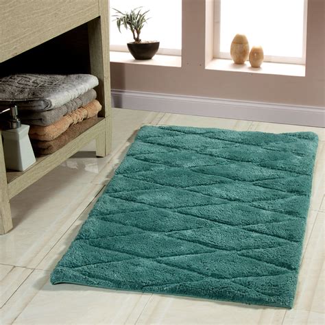 Bring warmth and color to your bathroom with this plush bath rug, available in a variety of bold hues including apple green, teal, champagne cream, espresso brown, graphite grey, hickory brown, navy, and many more. . Wayfair bath rugs
